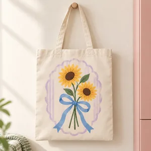 Tote bag Dos girasoles con lazo azul. Dos girasoles enlazados por un lazo azul forman una composición floral sin frase.